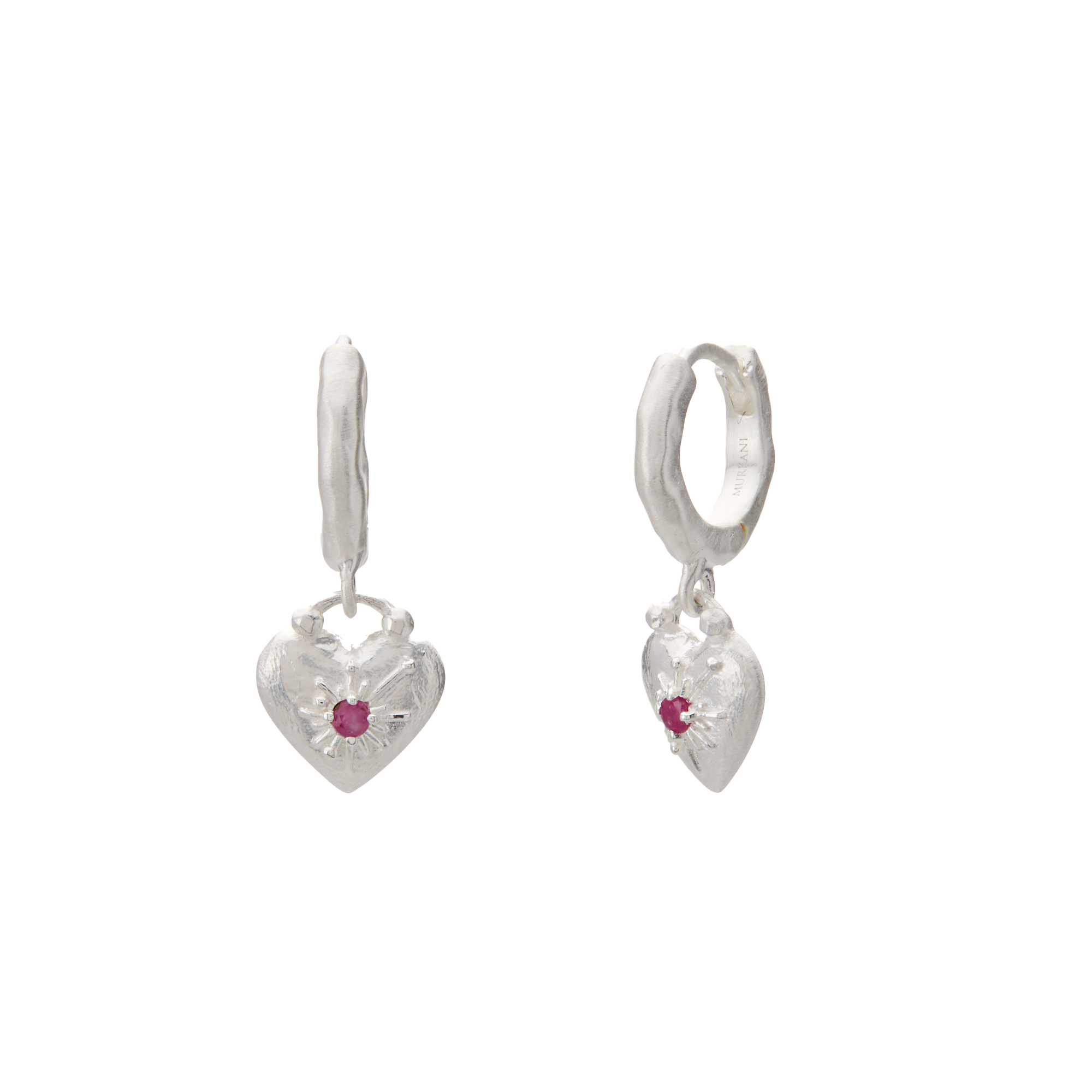 Heart-shaped silver earrings with red gemstones on a white background